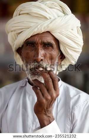 PUSHKAR,INDIA - November 3,2014 : Unidentified man with his traditional dress and turban    attends Pushkar Camel Fair