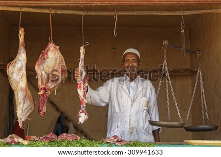 Ouarzazate, Morocco - July 27, 2015 :  Unidentified Butcher and the meats displayed in the butcher shop in the traditional Medina of Moroccan cities