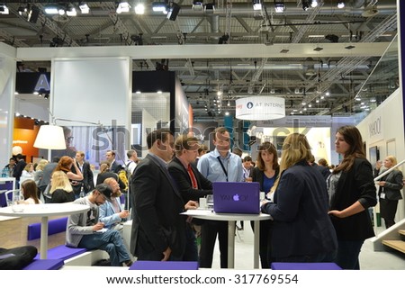 Cologne, Germany - September 16, 2015 - Young business people on digital marketing exhibition and trade show Dmexco