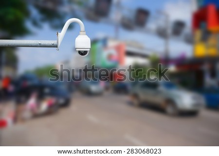 CCTV camera or surveillance operating on traffic road.Daytime