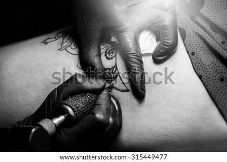 Showing process of making a tattoo gray tone : Tattoos art on human skin
