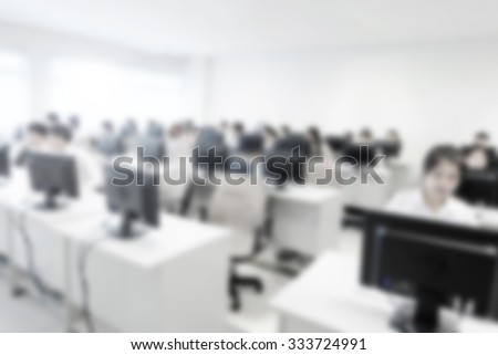 Abstract blurred background. Blur computer room in university. Network communication for education. Student using computer in learning and teaching.