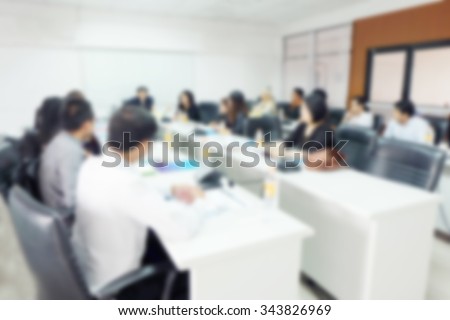 Blur of conference room. Administrators and teachers Meetings are planned and taught at the university level.