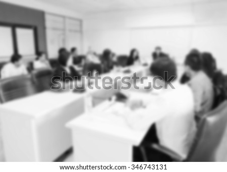 Blur of conference room gray tones. Administrators and teachers Meetings are planned and taught at the university level.