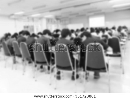 Blur of classroom. student during study or test and exams from teacher or professor in classroom in undergraduate at university in Thailand. meeting room.
