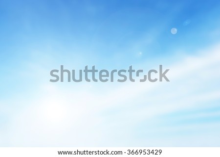 Abstract blurry bokeh background of Soft focus clouds blue sky with rays sunlight day time. Blur backdrop heaven for web. White gradient texture beauty. View city summer.
