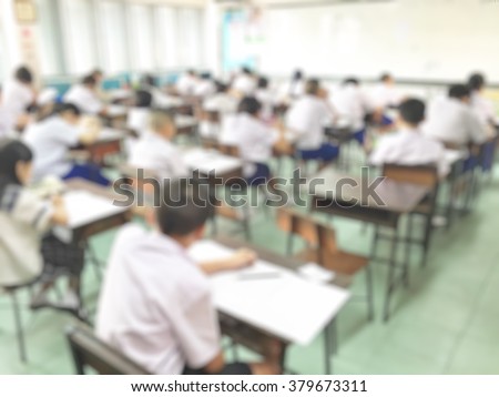 Abstract blur background of student during study or test and exams from teacher or in classroom in primary at school.