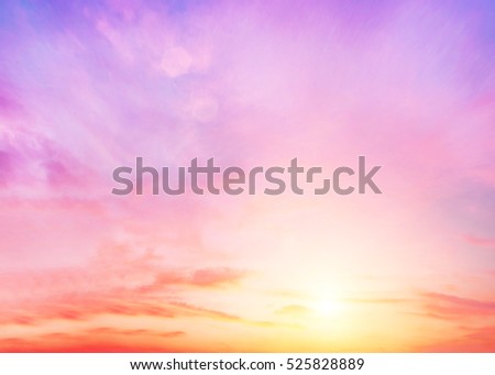 Peaceful landscape sunset. Colorful pink blur glowing bokeh and blue sky. Soft focus open view nature. Abstract background Orange and purple gradient. Sunbeam summer rays light sandy.