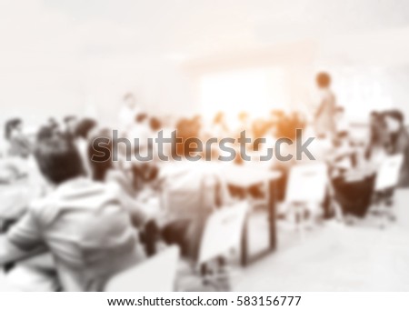 Blurred picture of student during study or exams in classroom in university. teacher kids learning abstract college school blurred testing professor training people lecture meeting group background