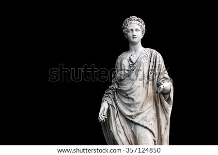Marble statue of roman Ceres or greek Demeter isolated on black from the park of the Palace and park complex Estate of G. Galagan. Sokyryntsi village, Ukraine. Horizontal reflection of the original