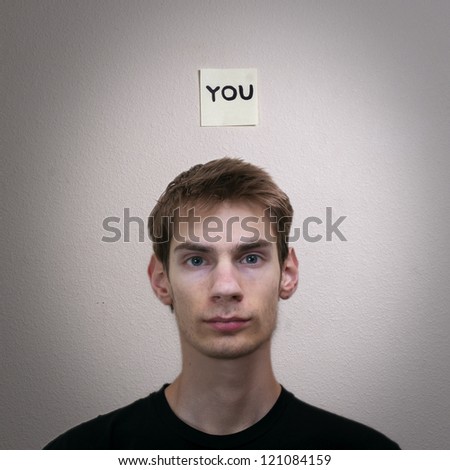 Portrait of a young male labelled as YOU.