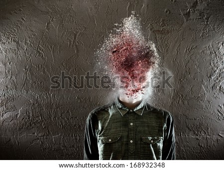 A man\'s head exploding. There is red in the middle and then some white on the edges.
