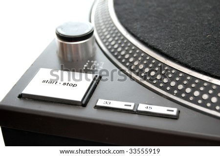 A close up of a DJ turntable isolted on white. Start/stop button.