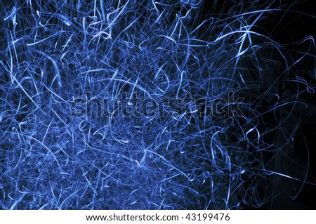 long exposure of blue glow in the dark lines of lights creating a unique glowing blue texture