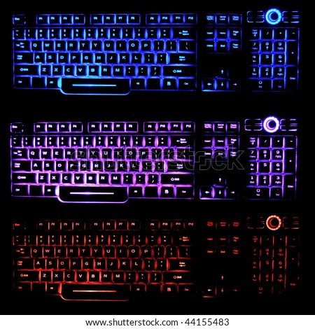 Transparent, blue, pink, and red backlit keyboards that glow in the dark, illuminated by LED light..