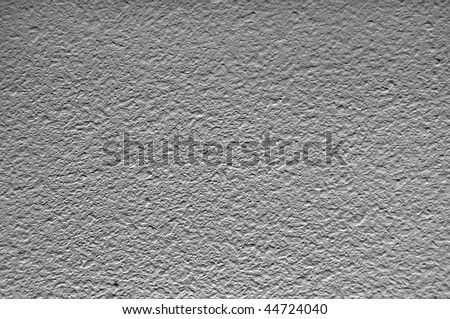 Abstract texture background of a painted ceiling. Image is a black and white photograph and crisp.