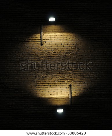 Old rough brick wall background texture with a spotlights shining on it