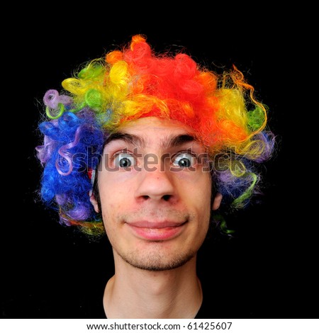stock-photo-a-silly-crazy-man-wearing-a-clown-wig-with-rainbow-colors-61425607.jpg