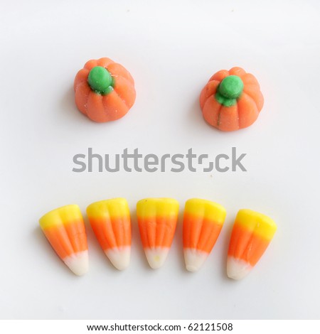 Sweet halloween Candy Corn isolated on a white background arranged in a scary pumpkin face