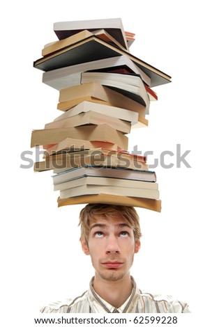 A young adult teenage man with stacks of books on top of his head. Isolated on white background.