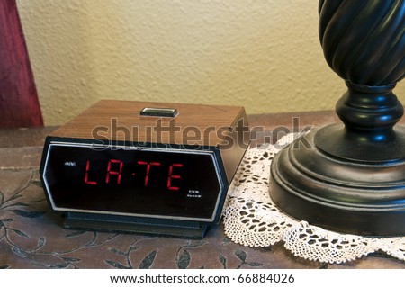 An alarm clock displaying the word \