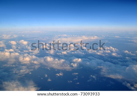 Photograph taken above the clouds over the Pacific Ocean.
