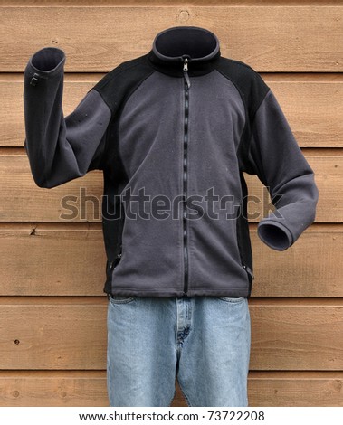 Science fiction photograph of an invisible man wearing a sweat shirt outside
