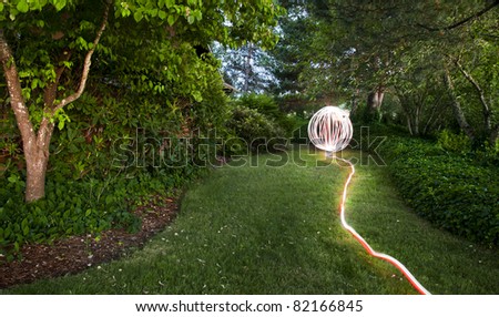 A light garden orb sphere in an oregon green garden yard
