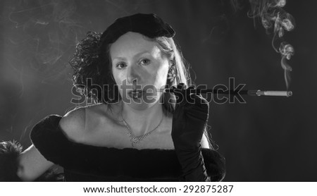 Black and White Portrait of Glamorous Woman Smoking Cigarette and Dressed in Vintage Clothing, Head and Shoulders Portrait in 1940s Film Noir Style