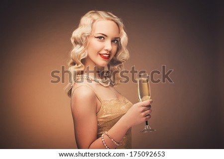 Vintage portrait. Young lady with a gold dress. Pearl beads.