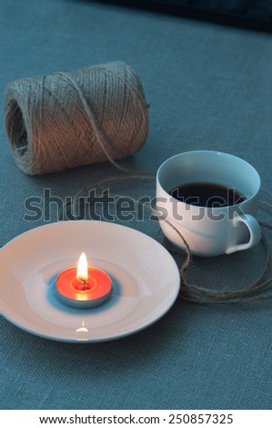 Cup of coffee and candle