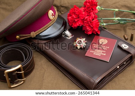 Still life with vintage objects dedicated to Victory Day. Order of the patriotic war 1st class.