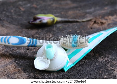 Still life with  old toothbrush and toothpaste tubes