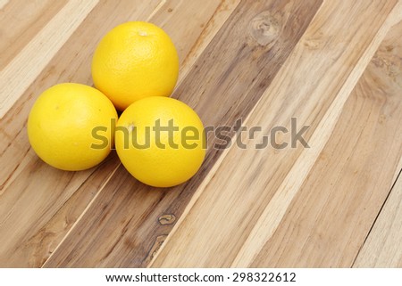 oranges on textured weathered wooden table