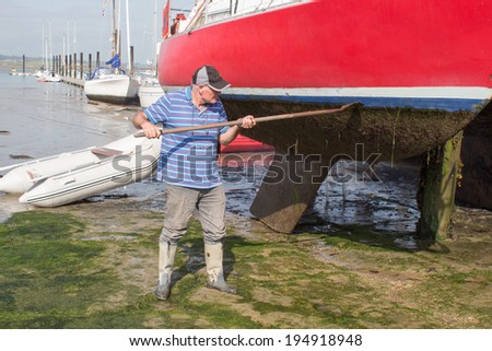 Man cleaning boat