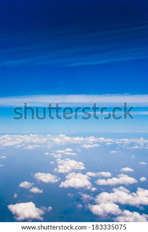 Coastline, mountains, ocean and clouds airplane view