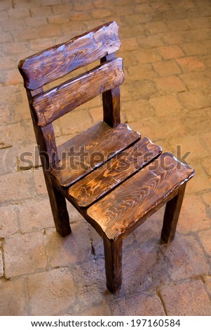 Old retro style wooden chair on a stone floor
