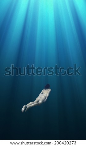 Fantasy naked female diver deep under water