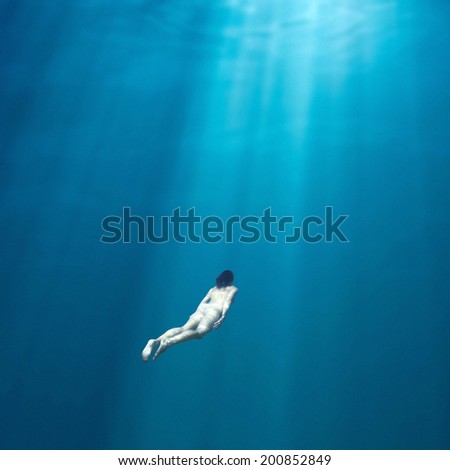 Fantasy naked female diver deep under water Fantasy naked female diver deep under water
