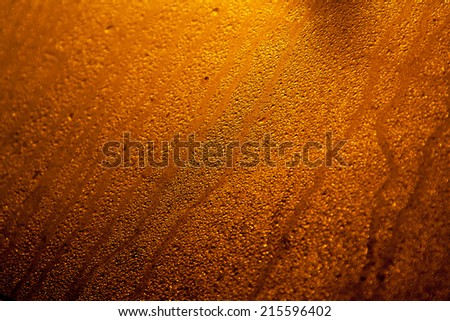 Abstract background with beads on a sweated window glass