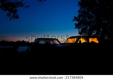 Dawn sun through the steamy car windows on the river bank
