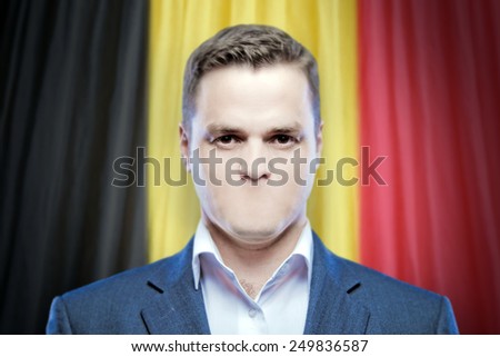 Symbol of censorship and freedom of speech: a young man without a mouth on a background of the national flag of Belgium