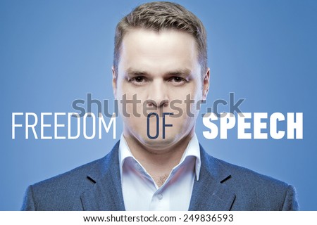 Serious young man without a mouth on a blue background with the words: Freedom of Speech
