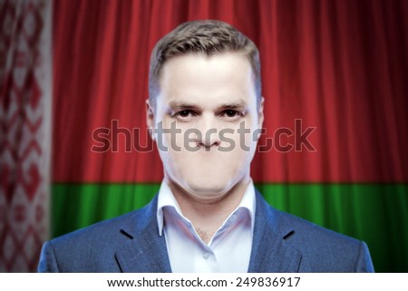 Symbol of censorship and freedom of speech: a young man without a mouth on a background of the national flag of Belarus