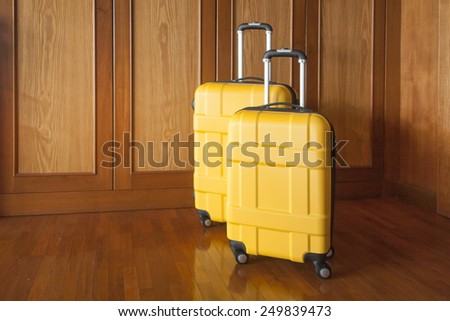 yellow plastic cases on the background of wooden wall