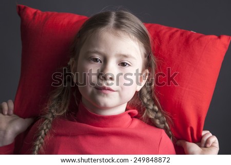 Beautiful girl with pigtails wants to sleep