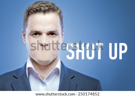Serious young man without a mouth on a blue background with the words: Shut Up