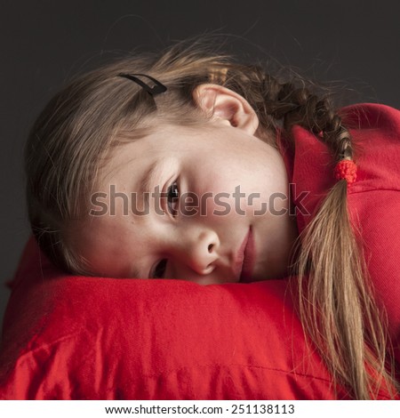 Beautiful girl with pigtails wants to sleep