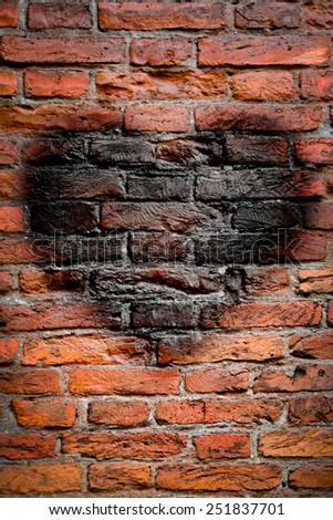 Old brick wall texture, picture of red heart for Valentine`s Day