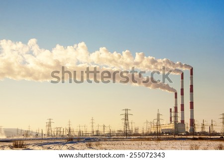 Smoking chimneys against the blue sky Smoking chimneys against the blue sky